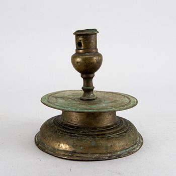 A BAROQUE BRASS CANDLESTICK, 18th century.