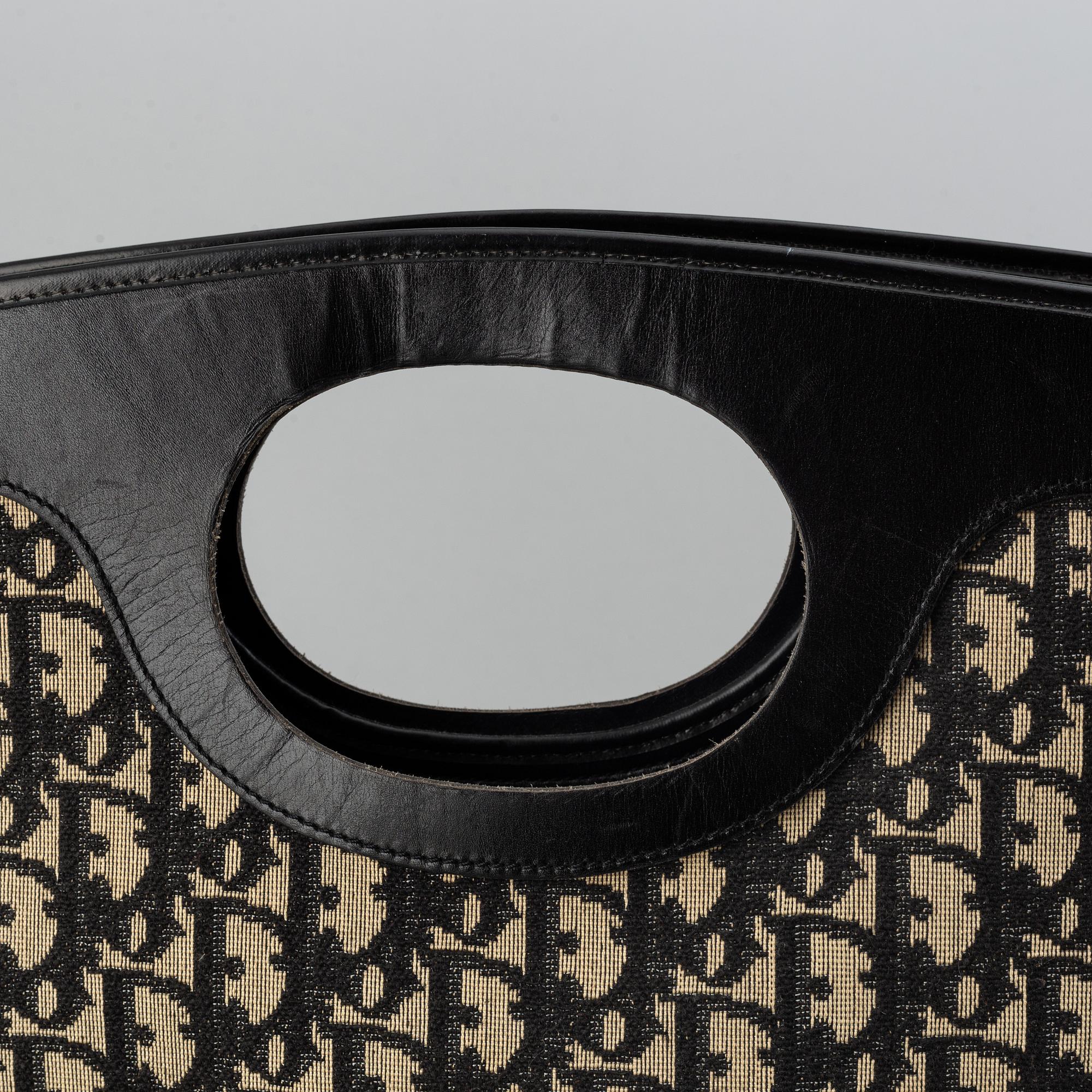 Christian Dior, Oblique fold-over convertible clutch.