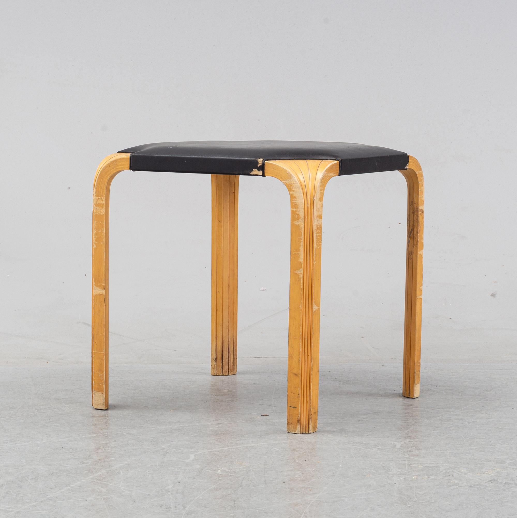 Alvar Aalto, a birch and leather stool, Artek, second half of the 20th century.