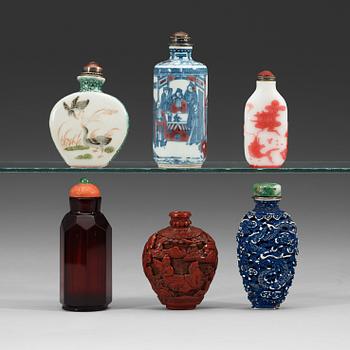 56. A set of six porcelain, red lacquer and glass snuff bottles, late Qing dynasty(1644-1912)/early Republic (1912-1949).