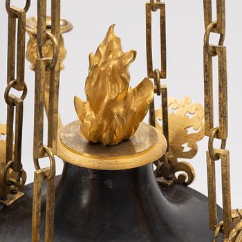 A French Empire ormolu and patinated bronze four-branch chandelier, early 19th century.