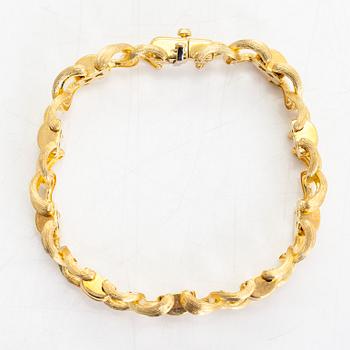 An 18K gold bracelet, signed by Henry Dunay, New York.