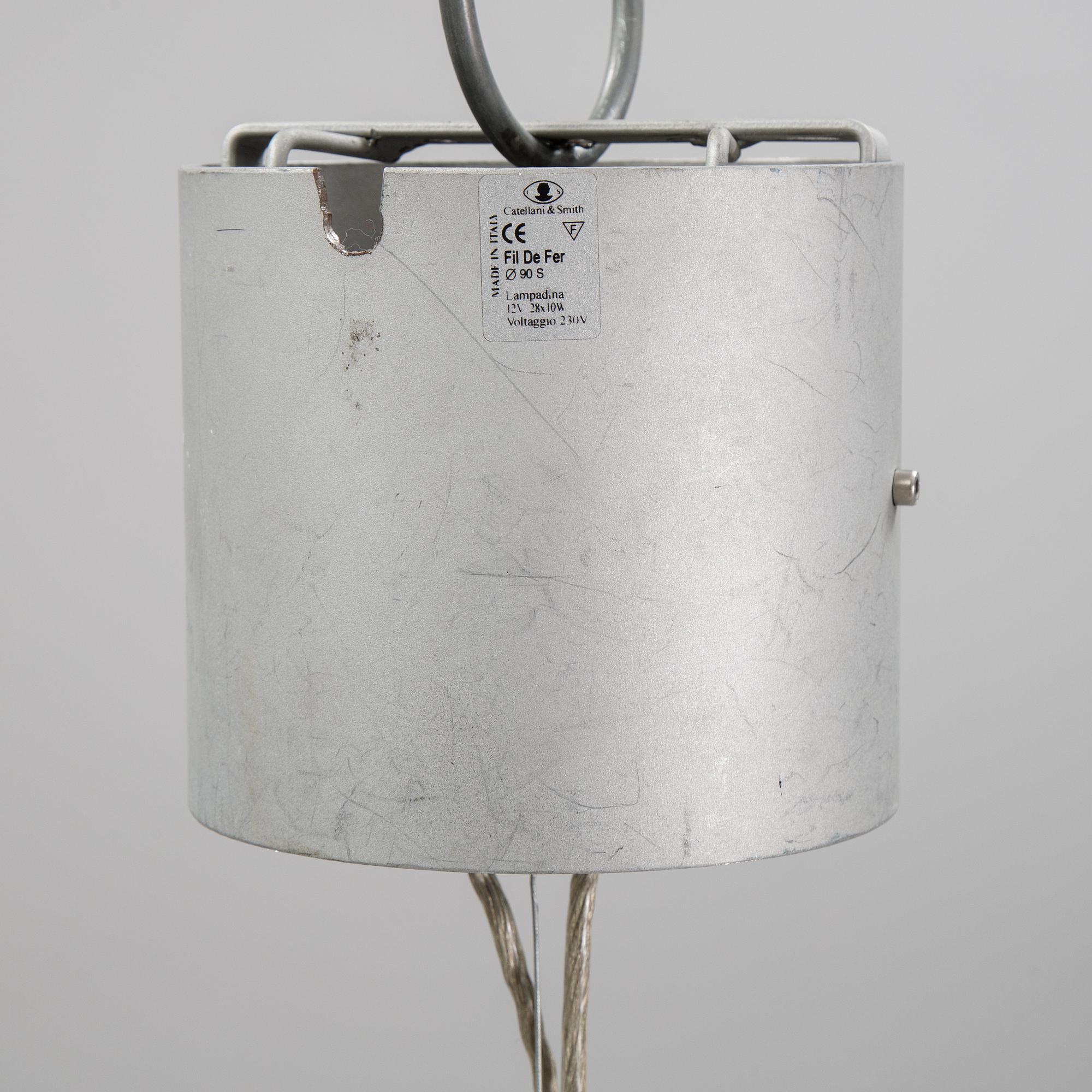 A 'Fil de Fer Ovale' ceiling light by Enzo Cattelini.