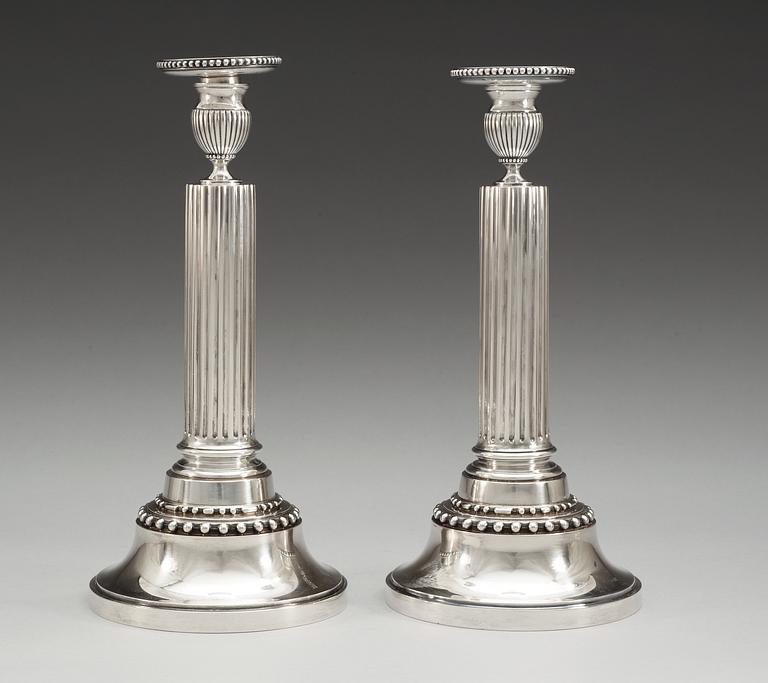 A pair of Swedish 19th cent silver candlesticks, makers mark of Gustaf Möllenborg, Sthlm 1895 and J.E. Torsk, Sthlm 1893.