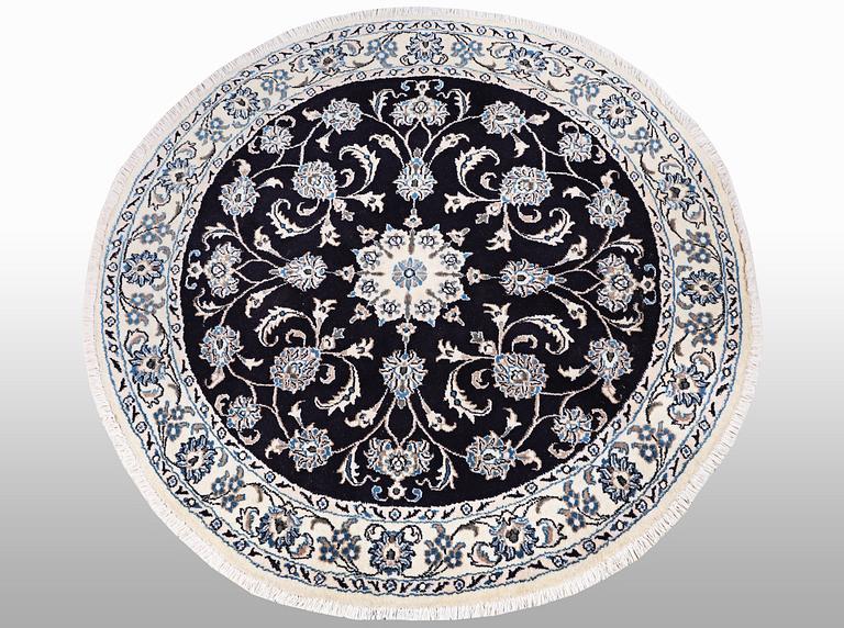 A rug, Nain, part silk, diameter ca 140 cm.