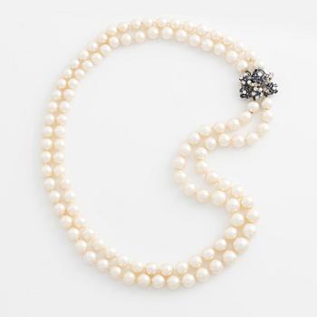 Pearl necklace, two rows, cultured pearls, clasp with diamonds and sapphires.