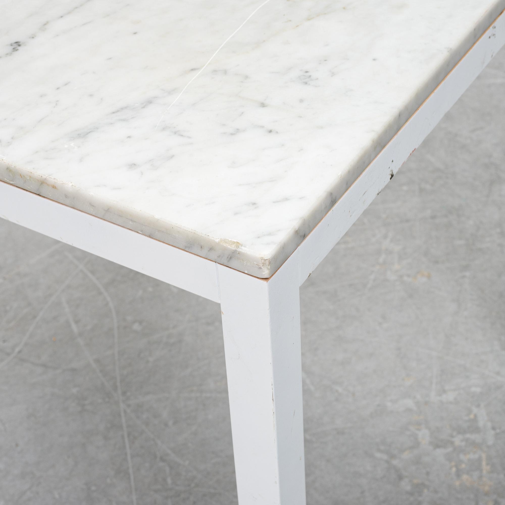 A marble top table, 21th century.