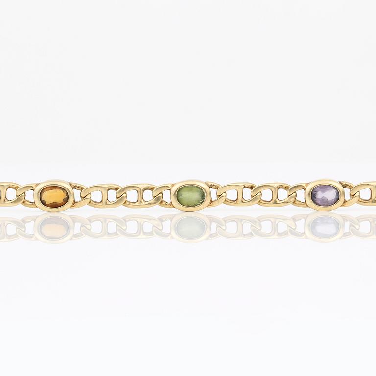 ARMBAND, 14K guld med olikfärgade stenar, sannolikt ametister, citriner och peridoter, Italien. Vikt 12,89 gram.