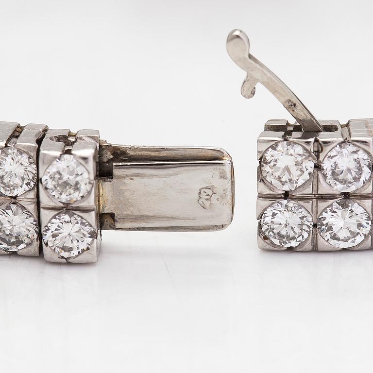 A platinum/18K white gold wristwatch, with brilliant and 16/16 cut diamonds totalling approximately 7.10 ct.