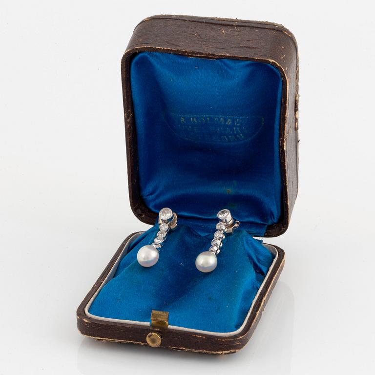 A pair of platinum and 18K white gold earrings set with pearls and old- and eight-cut diamonds.