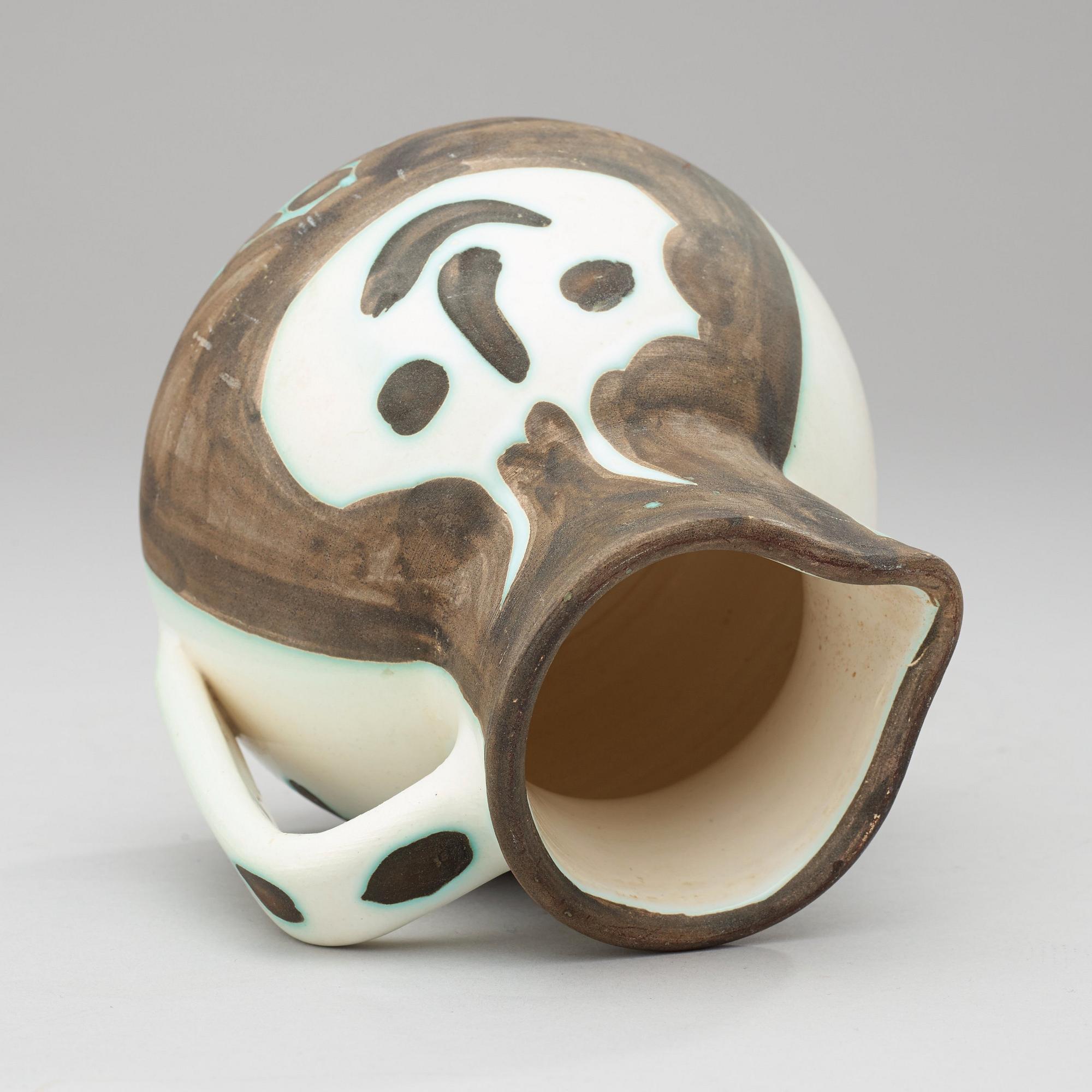 A Pablo Picasso 'Têtes' faience jug, Vallauris, France 1956.