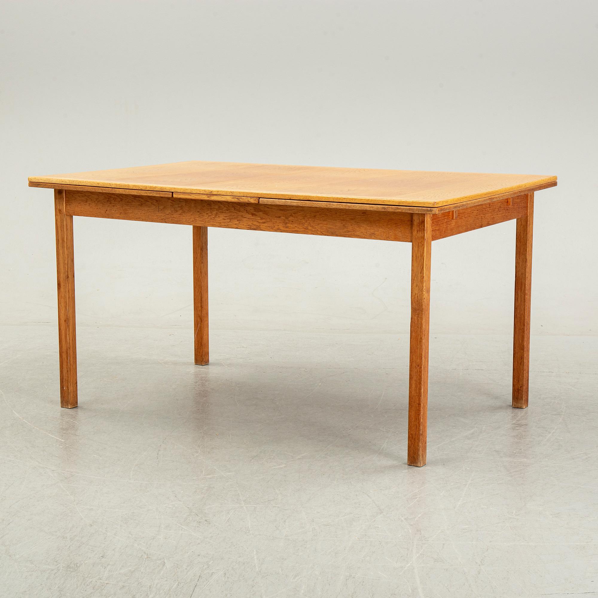 Knud Andersen, a set of six chairs for J.C.A Andersen, Aarhus, Denmark and a dinner table from Troeds, Bjärnum.