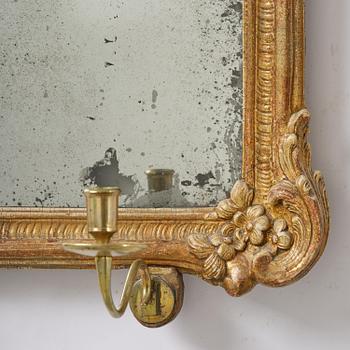 A two-branch giltwood rococo girandole mirror, Stockholm, later part 18th century.
