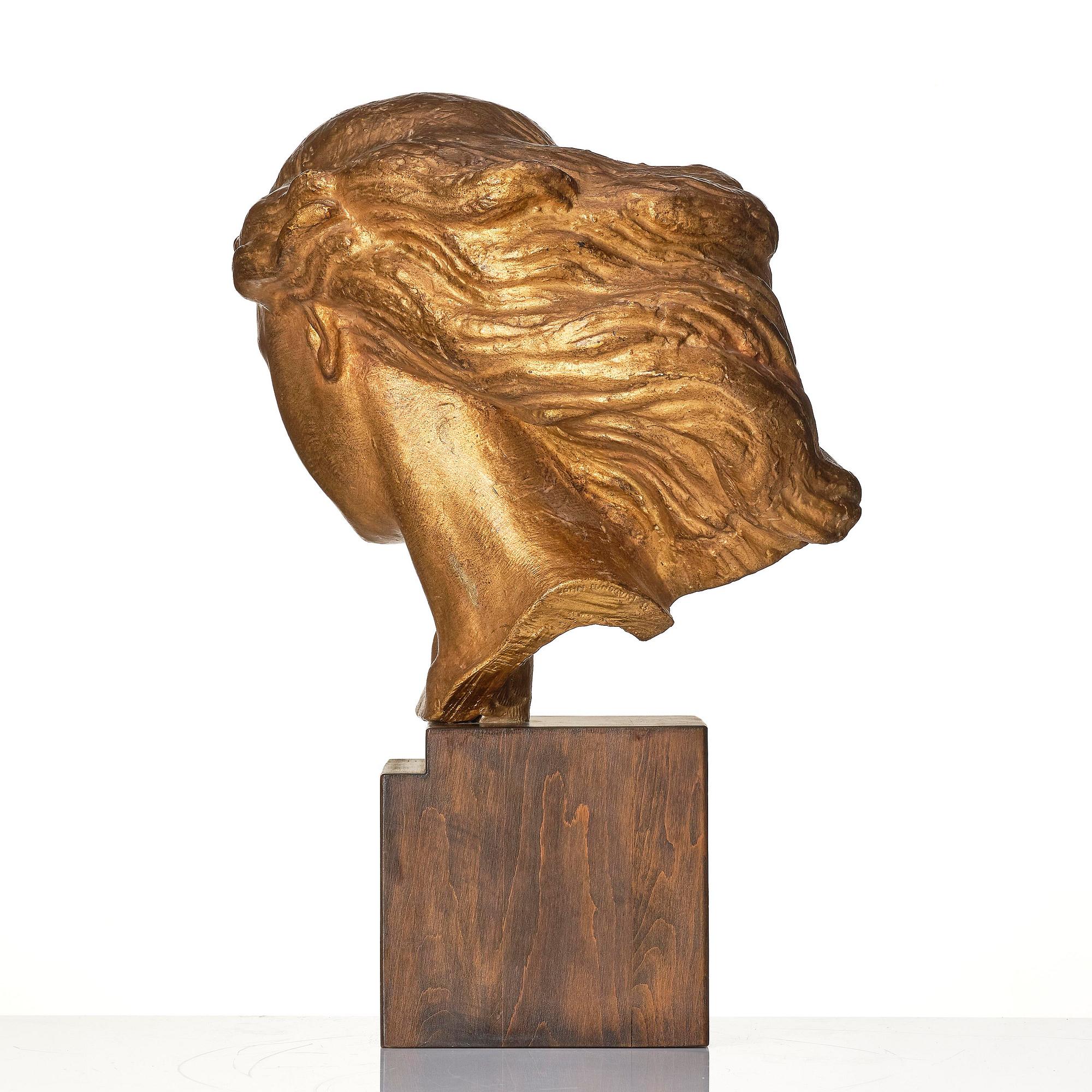 John Lundqvist, a gilt plaster sculpture of a young woman's head, dated 1933.