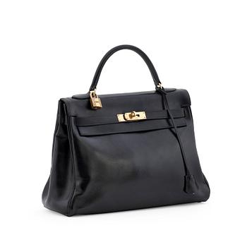 375. HERMÈS, a box black "Kelly 32" bag, before 1960.