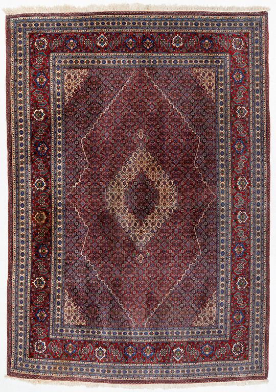 An oriental carpet, c. 371 x 264 cm.