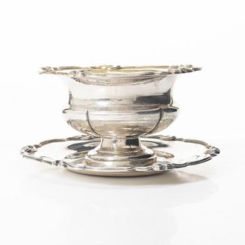 Gustaf Möllenborg, a silver bowl, Stockholm 1851, six silver punch cups, including CG Hallberg, and a silver spoon.