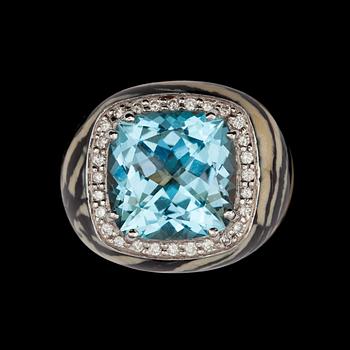 An aquamarine and brilliant cut diamond ring with zebra pattern.