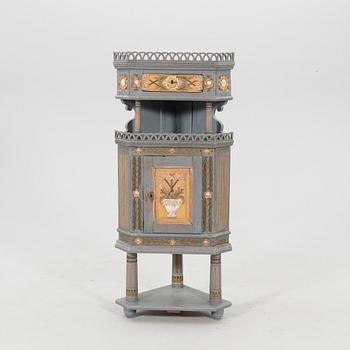 Corner cabinet from the first half of the 19th century.