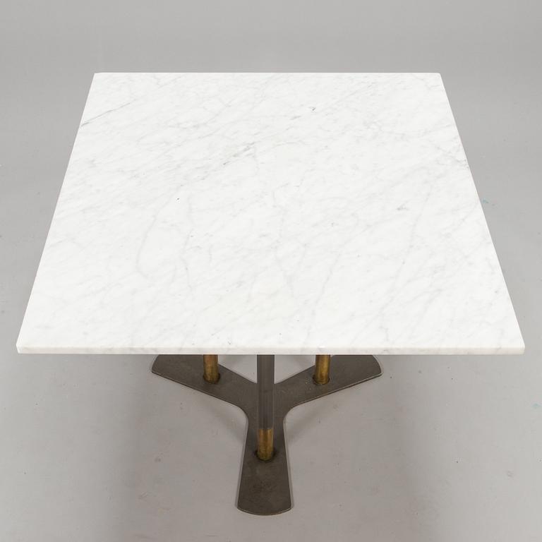 A marble top table, 21th century.