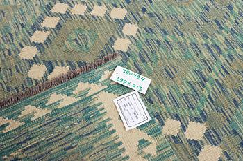 An Afghan kilim carpet, c. 299 x 213 cm.