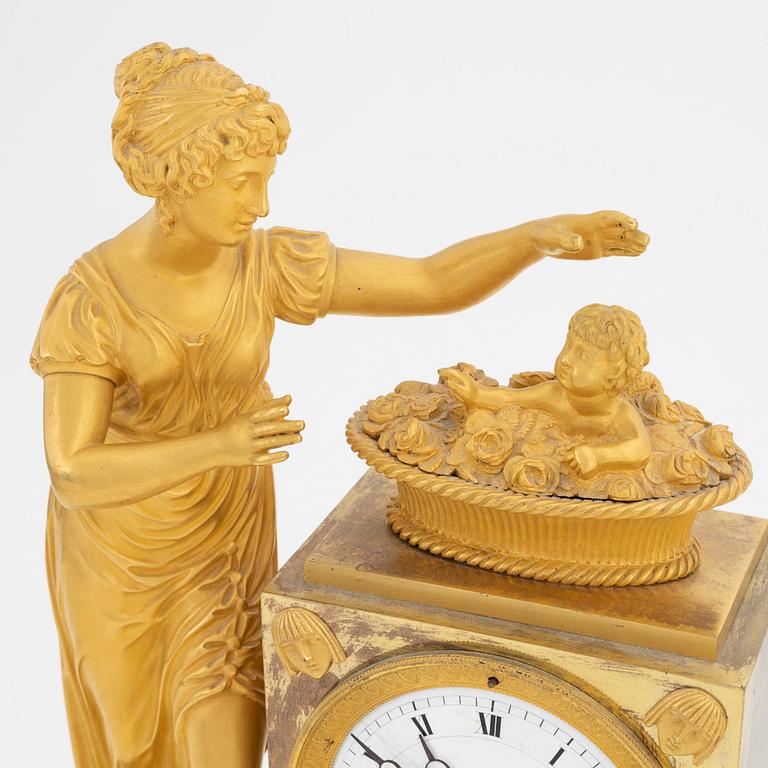 A French Empire gilt bronze mantle clock, early 20th Century.