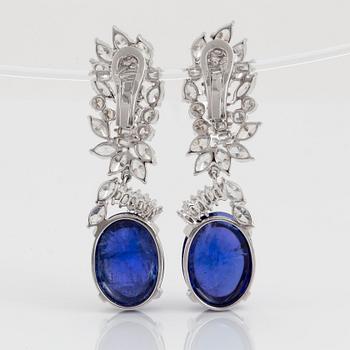 A pair of 18K gold tanzanite earings set with diamonds of various shapes.
