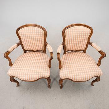 A pair of 19th century Rococo style armchairs.