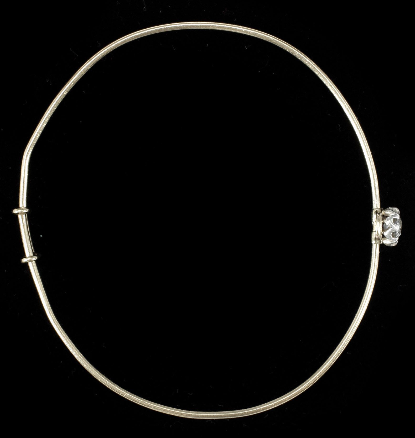 ARMRING, 18k guld samt antikslipad diamant ca 0.5 ct. Vikt ca 7,2 gram.