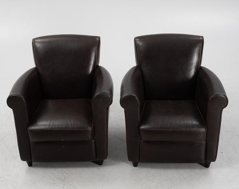 A pair of leather upholstered easy chairs, end of the 20th Century.