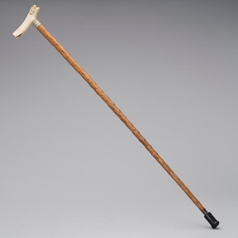 A WALKING STICK, bone and wood, late 19th century.