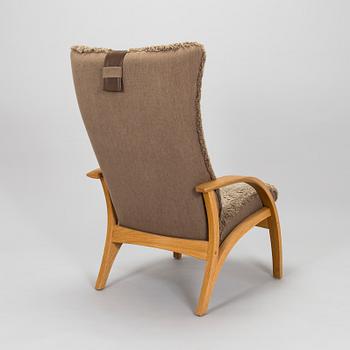 A 'Delta Adventure' armchair with ottoman, Brunstad, Norway.