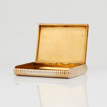 A Russian 20th century silver-gilt cigarette-case, marks of Anna Ringe, St. Petersburg 1908-1917.