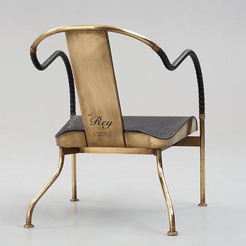 Mats Theselius, a brass and black leather el Rey chair, edition Källemo Sweden post 1999.