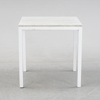 A marble top table, 21th century.
