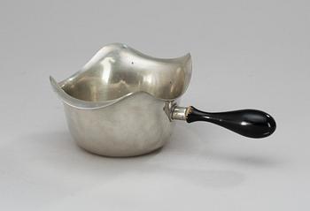 134. A pewter sauce-boat with a black wooden handle, Firma Svenskt Tenn 1948.