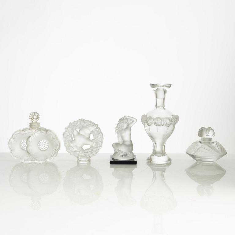 Lalique, four perfume bottles and five figurines, France, after 1945.
