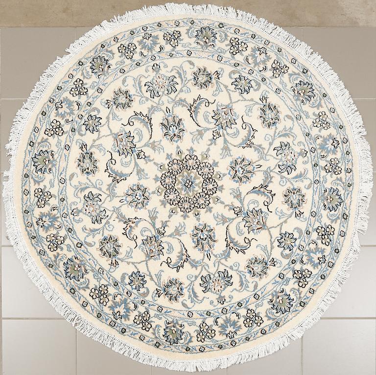 A Nain rug, diameter 143 cm.