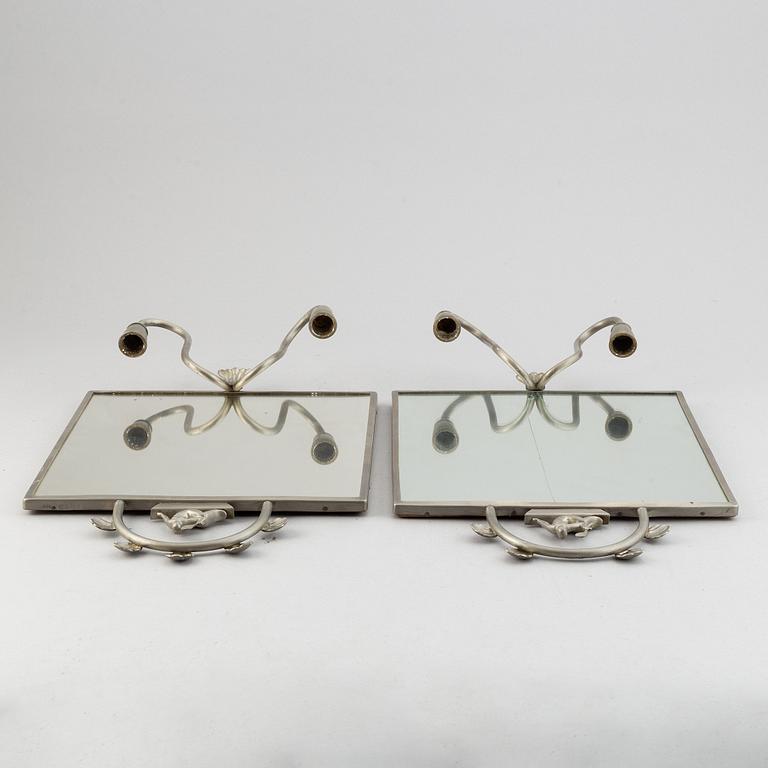 Two pewter wall sconces from Firma Svenskt Tenn, 1925.