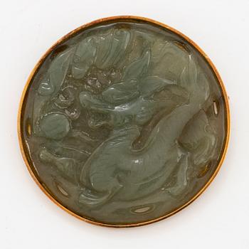 18K gold and carved green stone possible nephrite.