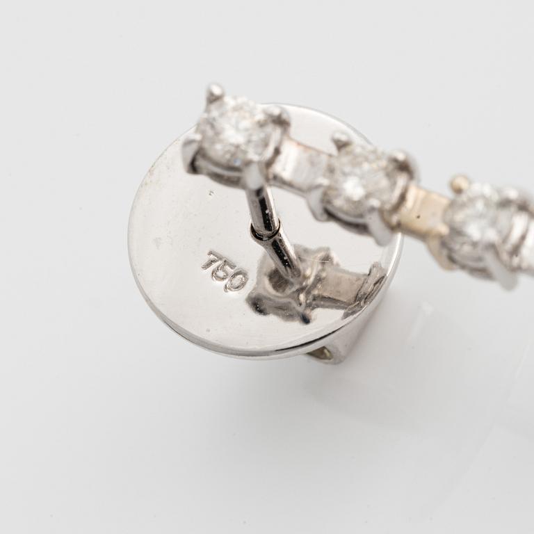 A pair of 18K gold earrings with round brilliant-cut diamonds and pink sapphires.