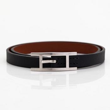 Hermès, a 'Behapi Double Tour' leather bracelet.