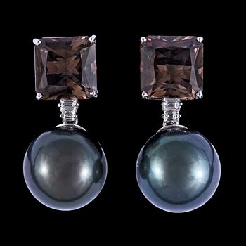 1108. A pair of cultured Tahiti pearl,14,8 mm, smoky quartz and diamond earrings, tot. app. 0.25 cts.