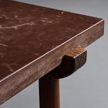 Axel Einar Hjorth, a red limestone top and stained pine side table, Nordiska Kompaniet, Sweden 1929.