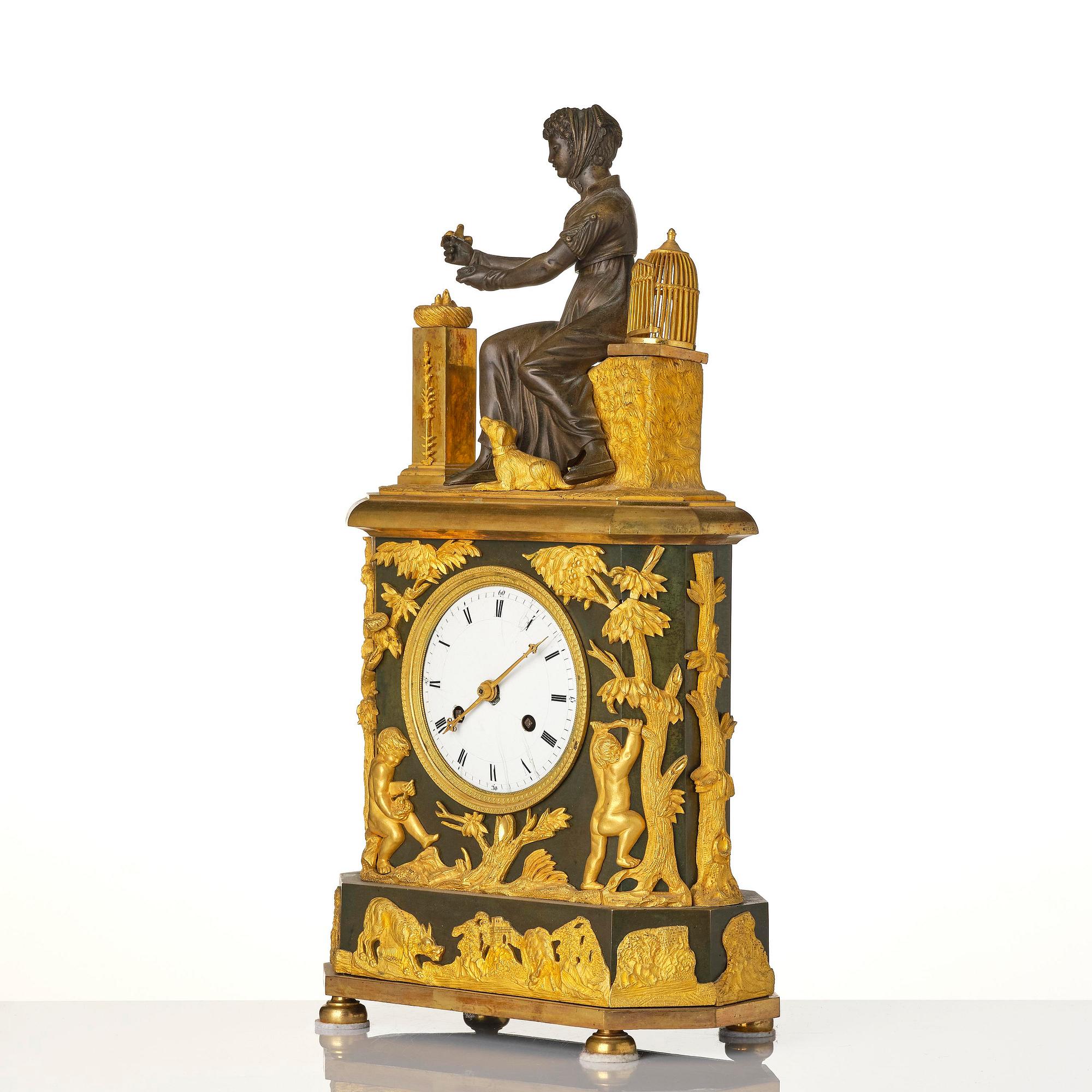 A French patinated and ormolu Directoire figural mantel clock, circa 1800.