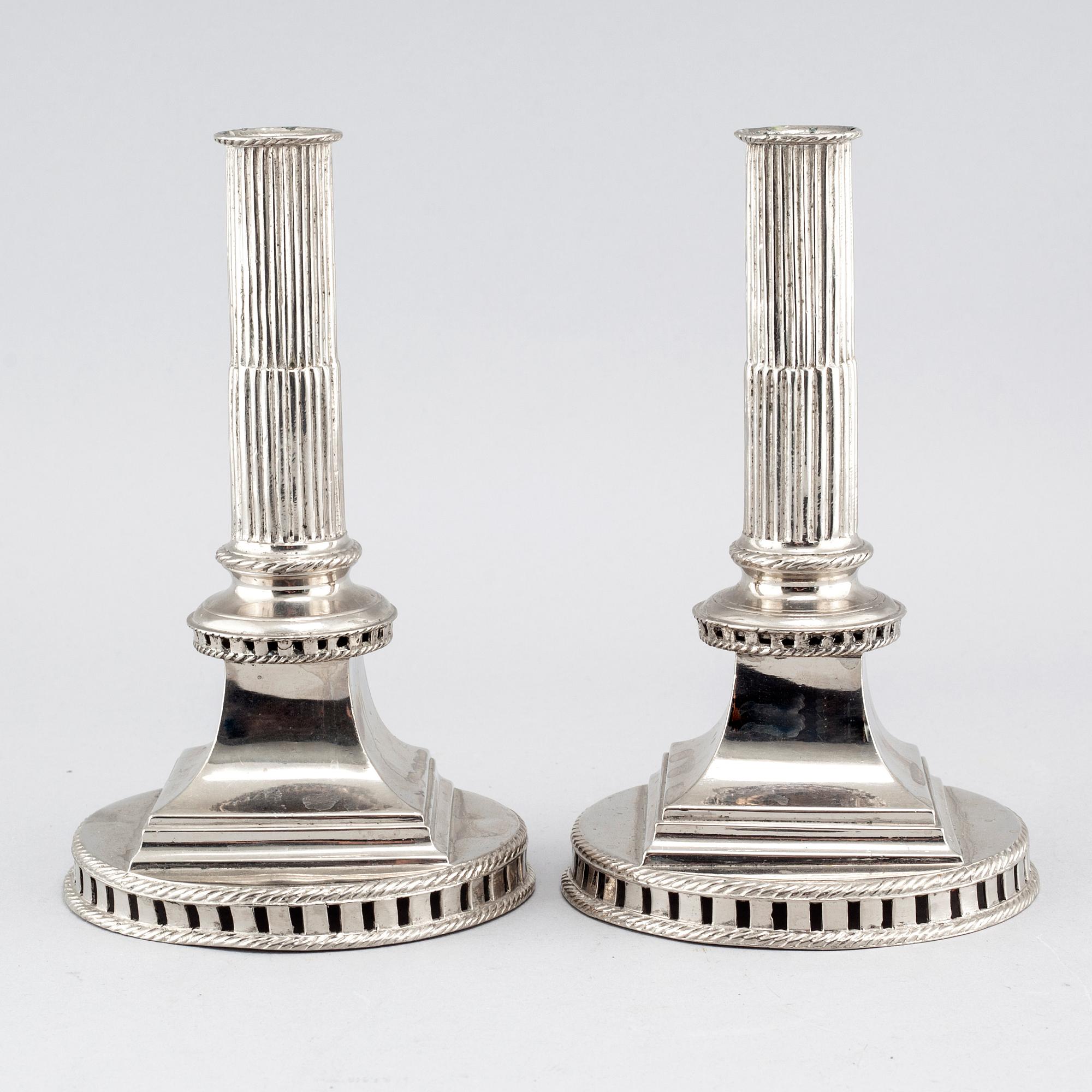 A pair of candlesticks in silver-plated pewter, by Gottlob Friedrich Baumann in Hudiksvall, 1794 and 1799.