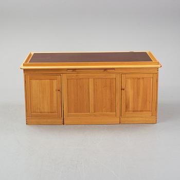 An oak writing desk by Finn N Hansen. End of the 20th Century.