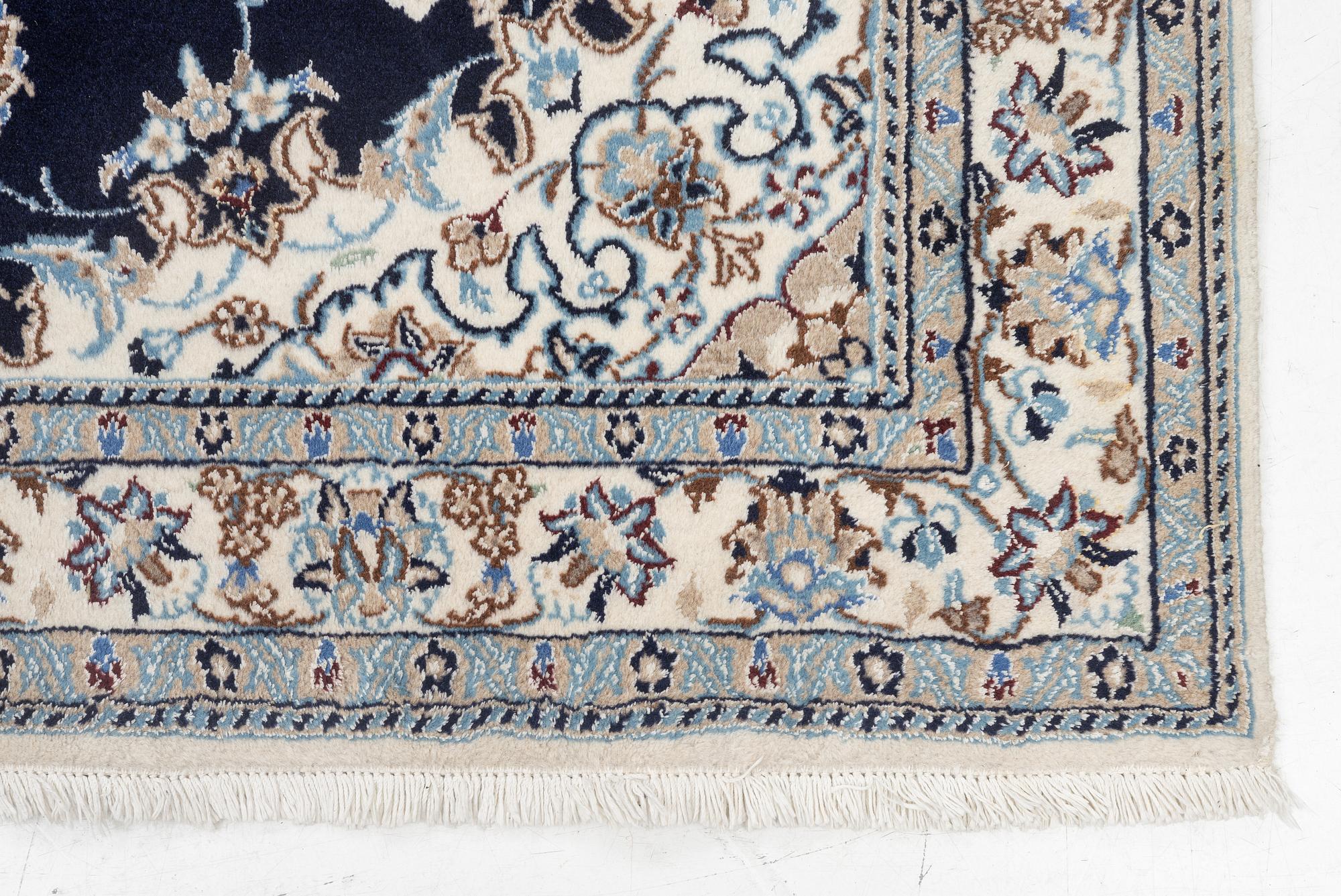 A Nain carpet, c. 255 x 150 cm.