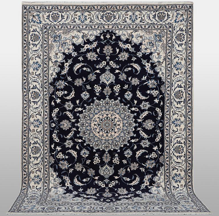 A carpet, Nain, part silk, ca 310 x 205 cm.