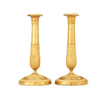 A pair of French Empire early 19th century candlesticks.